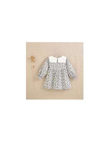 Vestido de bebé niña con estampado de hojas azul y mostaza con cuello babero blanco