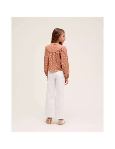 Blusa de niña naranja con estampado de hojas