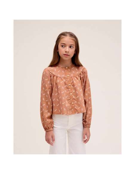 Blusa de niña naranja con estampado de hojas